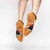 Colorful socks with abstract Kandinsky design worn by a person on a white background thumbnail
