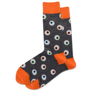 A pair of men's crew socks with a pattern of glowing eyeballs on a dark background and orange trim.