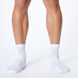 Front profile of a man wearing white Dr. Scholl's quarter socks. thumbnail
