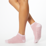 Person wearing pink two-toned tonal fuzzy Dr. Scholl's soothing spa socks. thumbnail