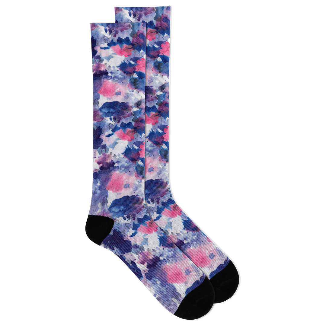 Pair of colorful floral-patterned socks on a black background
