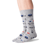 A pair of crew socks worn on a person's feet, featuring a gray heather base with a repeating pattern of blue and red police cars, sirens, and badges. thumbnail