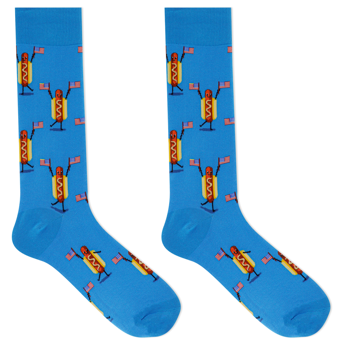 A pair of bright blue crew socks featuring a repeating cartoon hot dog character holding small American flags, shown on a plain white background.
