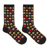 A pair of black crew socks with a repeating pattern of fast-food items including burgers, fries, drinks, and pizza slices, displayed against a solid white background. thumbnail