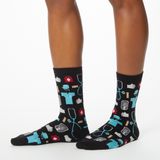 Woman wearing black socks with a repeat medical pattern thumbnail
