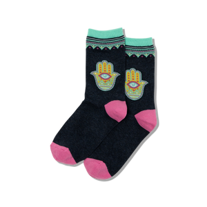 A pair of women's crew socks with a hamsa hand design in multicolor on a black background.