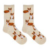 A pair of crew socks in a warm cream color, featuring an all-over print of Corgi dogs in orange, white, and brown, with small white bone motifs. thumbnail