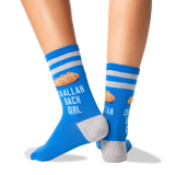 A pair of blue crew socks with gray stripes and heels/toes, featuring a croissant graphic and the text 'CHALLAH BACK GIRL' worn on a person's feet against a white background.