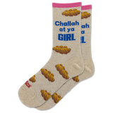 A pair of beige crew socks with a pink cuff, featuring a pattern of braided bread loops and blue text that reads 'Challah at ya GIRL'. One sock also has red text reading 'Sax' near the toe. thumbnail