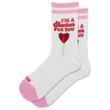 A pair of white crew socks with pink stripes at the top and pink toes/heels, featuring a red graphic of a lollipop and the text 'I'M A Sucker FOR YOU' on the front. thumbnail
