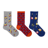 Three pairs of patterned crew socks displayed side by side on a plain white background. The left sock is heather gray with cartoon skateboarder prints.