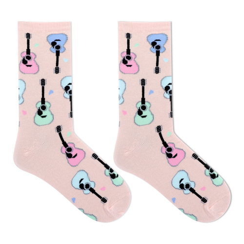 A pair of light pink crew socks with a repeating pattern of cartoon guitars in pastel pink, blue, and mint green, displayed on a clean white background.