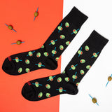 Black socks with green olive pattern on an orange and white background