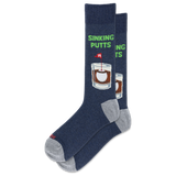 A pair of navy blue crew socks with gray heels and toes, featuring a graphic of a whiskey glass with a sinking putts flag and the text 'SINKING PUTTS' in green. thumbnail