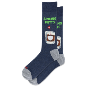A pair of navy blue crew socks with gray heels and toes, featuring a graphic of a whiskey glass with a sinking putts flag and the text 'SINKING PUTTS' in green.