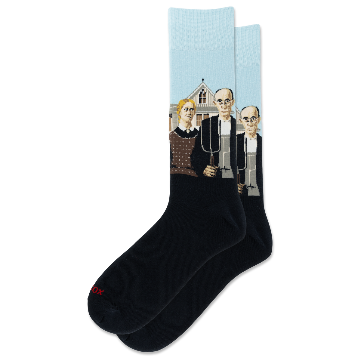 A pair of crew socks on a plain white background. The socks are black with Grant Woods' "American Gothic" on a light blue background, and a small red 'HOTSOX' logo near the toe.