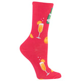 A single bright pink crew sock with a repeating pattern of champagne glasses, orange slices, and a green bottle on a white background.