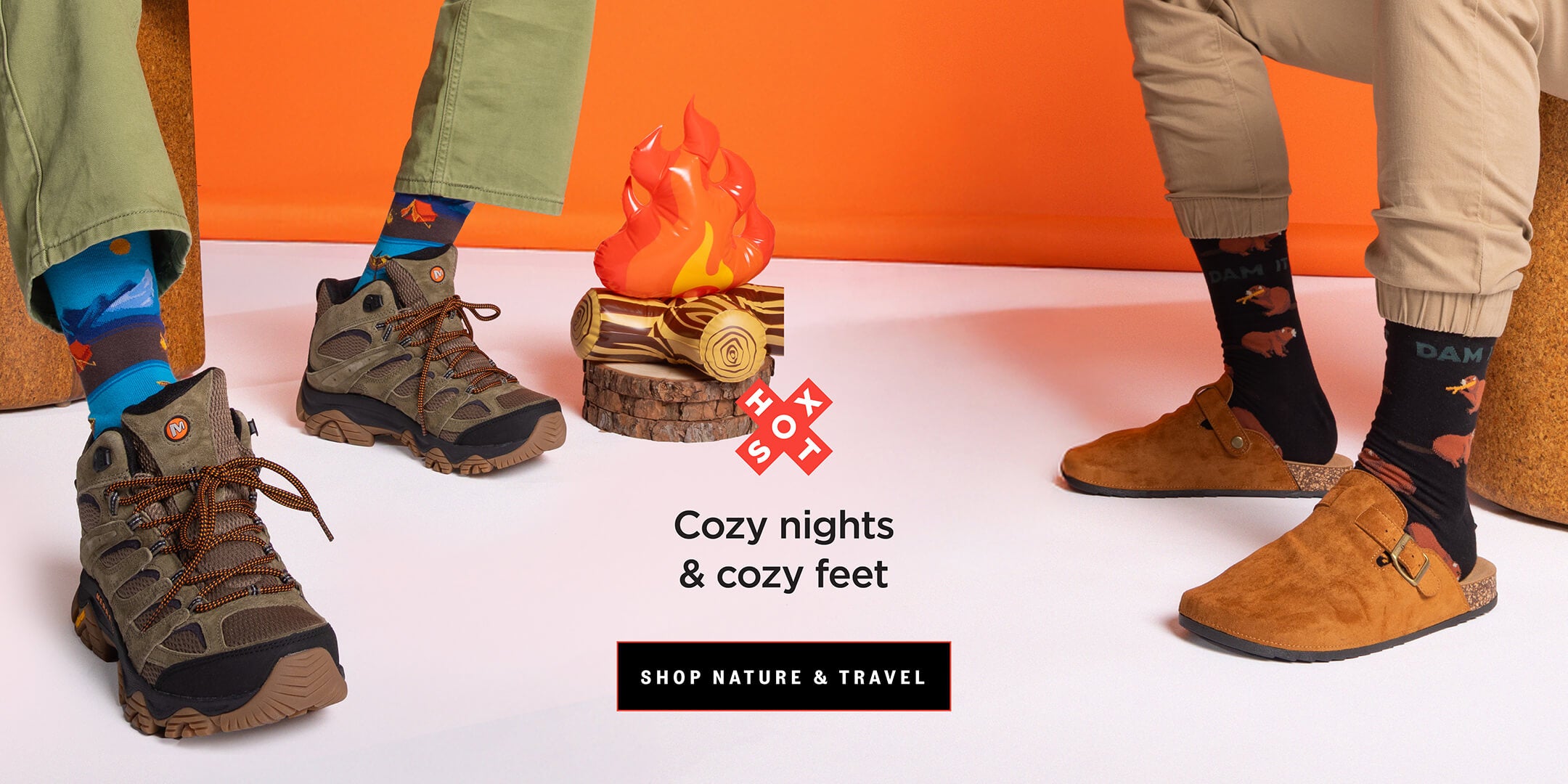 Two people sitting on orange stools wearing boots and colorful outdoors-themed socks.