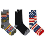 Three pairs of socks with different designs on a white background