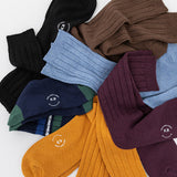 Assorted colorful socks with a K.Bell brand logo on a white background