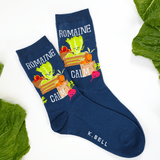 Navy blue socks with vegetable design and 'K. Bell' branding on a white background with green leaves. thumbnail