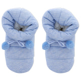 Pair of blue baby booties with pom-poms on a white background