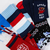 Collection of colorful socks with various patterns and text on a white background thumbnail