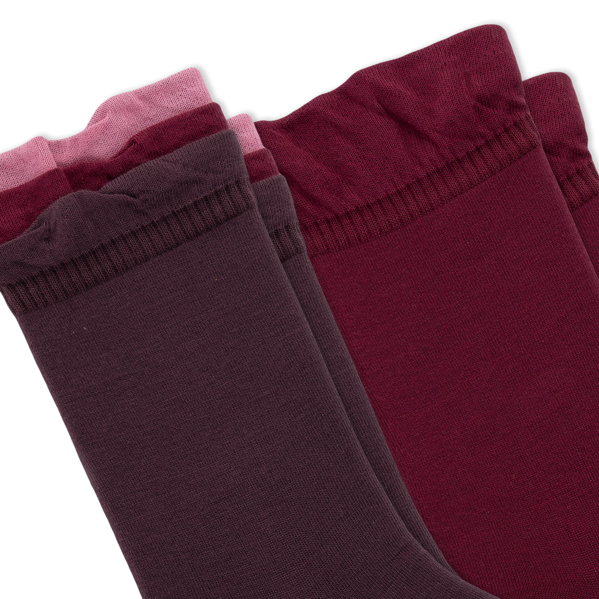 Two pairs of crew socks fanned out on a white background, with three tiers of ruffled colors from dark plum to burgundy, maroon, and dusty pink.