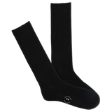 A pair of black ribbed crew socks with a visible K.Bell brand logo on the sole.