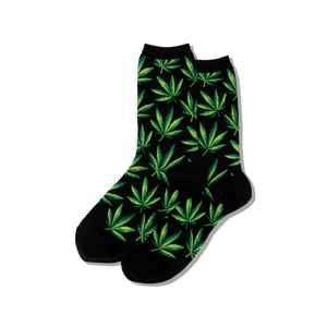 Black socks with green marijuana leaf pattern on a white background