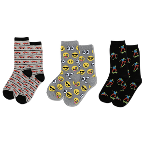 Three pairs of socks with cars, smiley faces and skateboard patterns on a white background