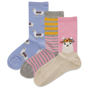 HOTSOX girls' llama novelty crew sock three pair pack with a repeat llama pattern sock, a gray, pink and macaroni yellow striped sock, and a pink sock with closeup artwork of a llama with a flower crown.