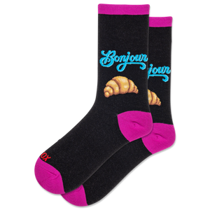 Black socks with pink accents, blue text, and croissant illustrations on a white background