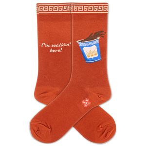 Orange socks with a spilling coffee cup  design and text on a white background