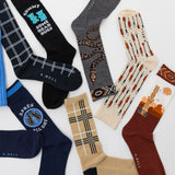Collection of various socks with different designs and colors on a white background thumbnail