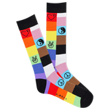 A pair of men's crew socks with a multicolored patch design featuring symbols such as hearts and peace signs. thumbnail