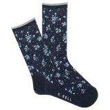 Navy socks with small floral pattern on a white background, featuring K. Bell branding.