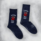 Navy socks with 'Apèrs All Day' text and graphic on a snowy background thumbnail