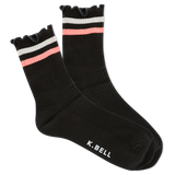 Black socks with pink and white stripes on a white background, featuring the brand 'K. Bell'.