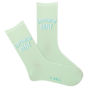 Pair of light green socks with 'Empower Mint' text on a white background
