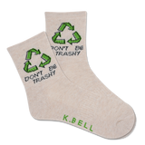 A pair of white crew socks with green recycling symbols and the text 'DON'T BE TRASHY' printed on the side, signed by 'K.BELL'. thumbnail
