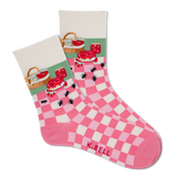 Pair of socks with checkered pattern and K. Bell branding on a white background
