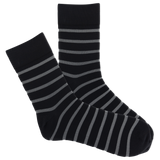 Sheer striped black socks on a white background