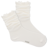 White ruffled sock with 'k.bell' branding on a white background