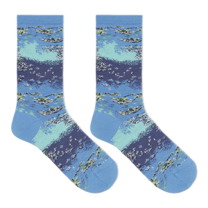 A pair of women's crew socks with a Monet's water lilies print in blue, green, and white colors.