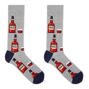 A pair of men's crew socks with a bourbon design, featuring illustrations of bourbon bottles and a glass on a gray background.
